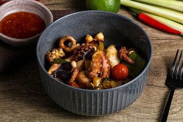 Roasted octopus with vegetables and oil