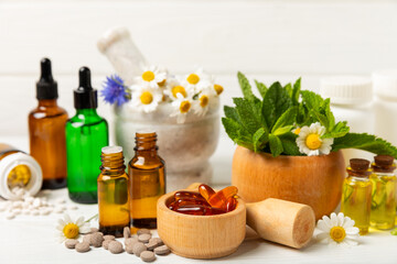 Alternative medicine herbal capsule organic drug on wooden background.Assortment of herbal and tablets,vitamins and dietary supplements.medicinal and Healing herbs.natural supplements for healthy life