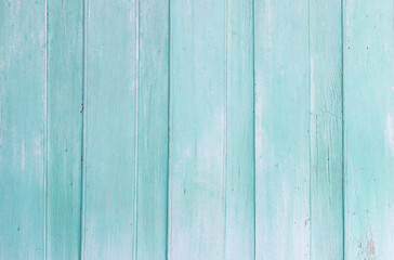 Obraz premium Close-up of light turquoise wooden plank wall with natural grain, vintage rustic surface perfect for background or decoration.