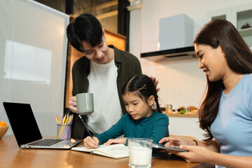 Family Asian spending happy time together on vacation, sitting in the kitchen.