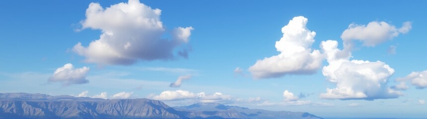 Many clouds that are flying over the mountains