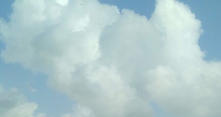 Beautiful white clouds in the blue sky background