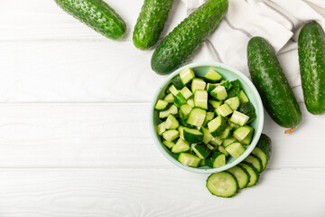 Cucumber on wooden background. Slice of cucumber on background. Fresh organic green cucumbers...
