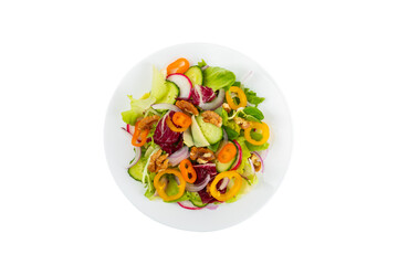 Cucumber salad isolated on white background. Homemade salad with fresh vegetables, cucumber, tomato, sweet pepper and lettuce in a plate. Vegetarian spring salad. Vegetarian diet. Healthy eating.