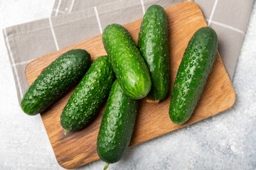 Cucumber on wooden background. Slice of cucumber on background. Fresh organic green cucumbers...