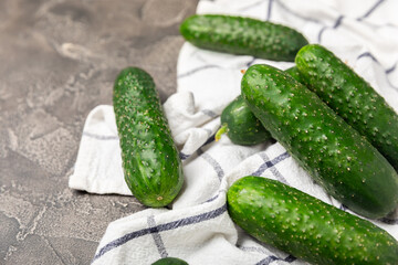 Cucumber on wooden background. Slice of cucumber on background. Fresh organic green cucumbers gherkin. Vegan. Salad ingredient. Farm vegetables. Cut vegetables with knife. Space for text. Copy space