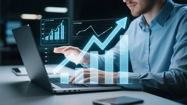 Man working on laptop with rising graph overlay showing business growth and financial analysis