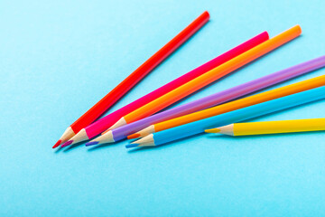 Colored pencils on a bright colored background. Equipment for coloring. Stationery for creativity.Back to school. Flatlay. Children's Creativity and Education. Rainbow.Space for text. Copy space.