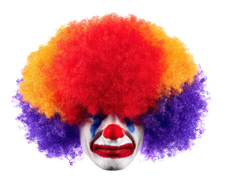 Colorful clown wig sad face red nose white makeup blue tear isolated curly hair vibrant party costume emotional expression