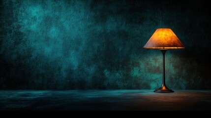 A vintage lamp illuminates a moody teal wall, creating a nostalgic atmosphere