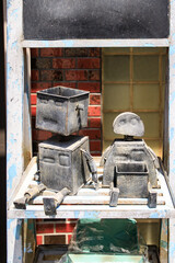 Retro Robot Art: Metal Figures on Rustic Shelf