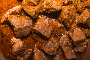 A traditional Bengali dish, known as Goat Liver Curry or mutton 