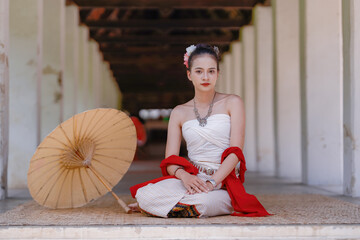 An Asian woman wearing traditional Thai attire in a vintage style, representative of Thai culture,...