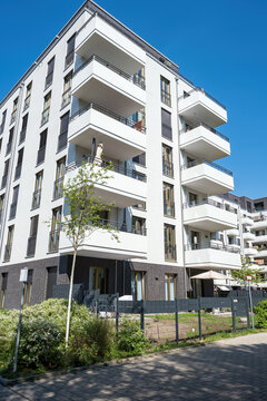 Modern white multifamily residential building seen in Berlin, Germany