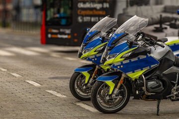A police motorcycle parked in the middle of the road during a protest picket