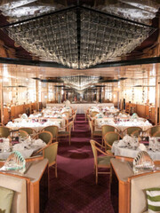 Formal and elegant ocean view dining room restaurant onboard luxury cruiseship or cruise ship liner...