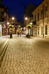NOWY SACZ, POLAND - JULY 12, 2025: Cobbled streets at the sunset around the main market square in...