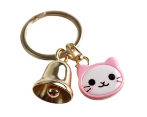 Cute cat face keychain with pink border and gold bell, isolated on transparency background, playful and charming accessory for bags or keys
