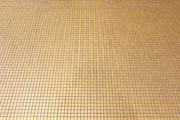 Small square brown-gold mosaic tiles for home flooring - interior and exterior architectural and design 