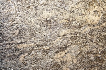 Rough grey granite stone with light, marble, quartzite, and natural stone is ideal for countertops, kitchen sinks, flooring, and cladding, for both interior and exterior architectural and design 
