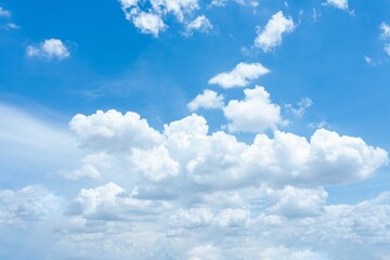 Bright blue sky with fluffy cumulus clouds A panoramic view of a summer sky