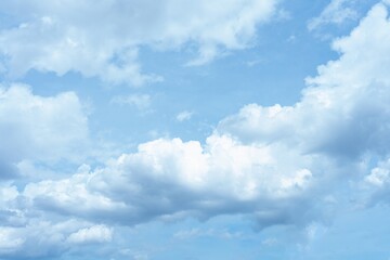 Bright blue sky with fluffy white cumulus clouds A daytime sky scene white clouds