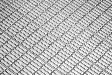 A close-up shot showcases a repeating pattern of textured, rectangular elements arranged...