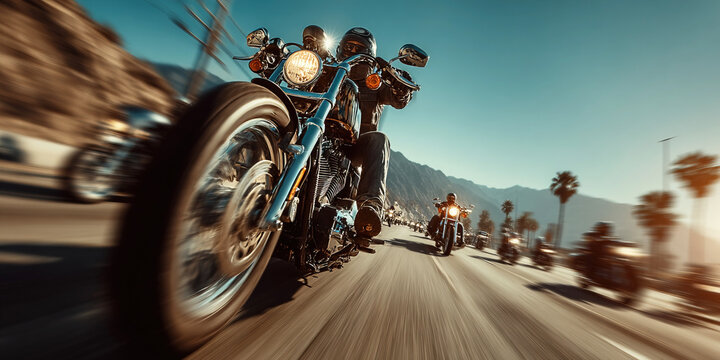Modern bikers ride together on a scenic highway under the sun