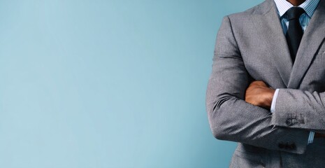 Professional Man Wearing Gray Suit Crossed Arms Confident Pose Modern Background