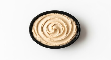 Top view of a creamy swirl dessert in a black bowl