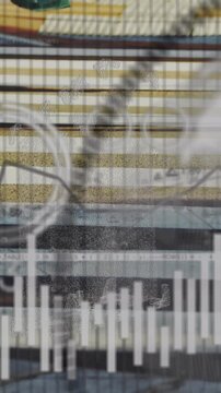 Animation of data charts overlaying industrial machinery with gears turning