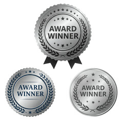 Three silver award winner seal design with stars and laurels for recognition and achievement