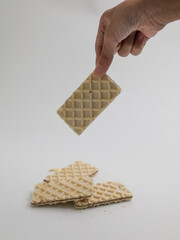 Waffle biscuits, stacked on white background