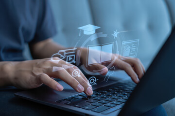 Person typing on laptop with digital learning icons hovering above the keyboard in a modern setting