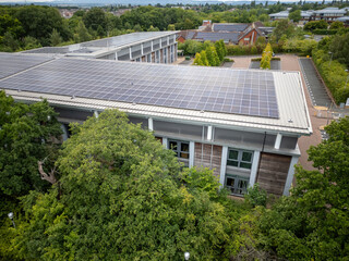 Aerial View of Modern Eco-Friendly Office or Campus Building with Solar Panels and Surrounding...