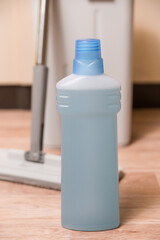 Bottle of Floor Cleaner with Mop and Bucket
