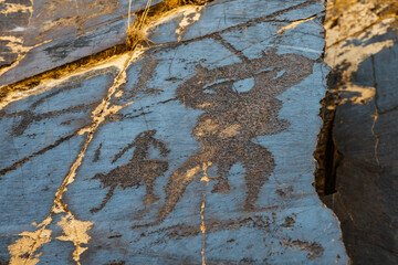 SARMYSHASHAI, UZBEKISTAN - JULY 10, 2023: The ancient petroglyphs on the rocks contain more than 5,000 images of flora and fauna, making them a unique natural and archaeological site. 