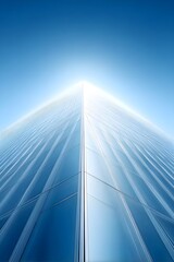 Modern skyscraper reaching towards a clear blue sky