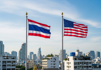 The United States flag and the Thai flag are mounted on poles against a background of blue sky and buildings.