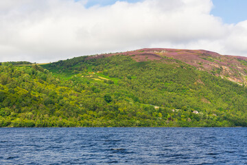 Loch Ness embracing the Scottish Highlands landscape on a cloudy day