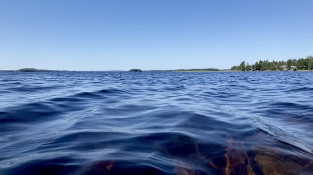 Slow Motion Close-Up of Lake Saimaa Waves on a Sunny Summer Day