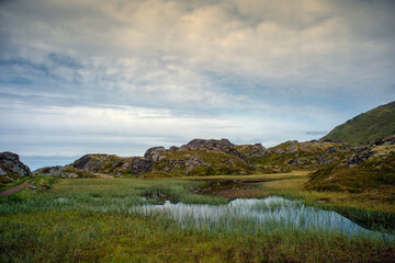 mountain landscape with lake and clouds