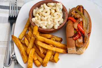 chicken sausage in a bun  with macaroni salad