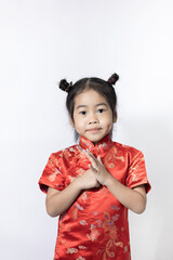 A baby girl wearing a red Chinese dress on white background.
