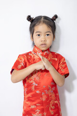 A baby girl wearing a red Chinese dress on white background.