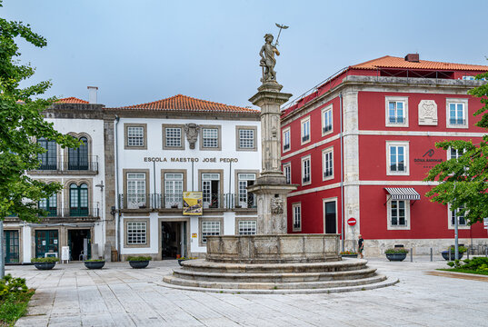 A monument in front of stylish buildings in the town of Viana do Castelo, Portugal