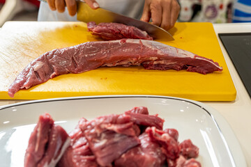 Slicing a Solomillo Steak for a Spanish Recipe. Concept The foundation of a hearty meal.