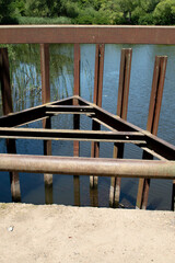 A rusted part of the lifting mechanism of an old dam	