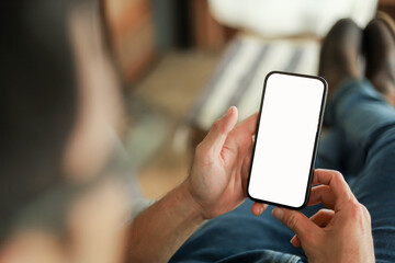 Mobile phone blank white screen mockup.texting using cell phone.background empty space for...