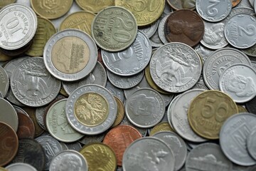 Big pile of different coins from various currencies and different countries around the world....